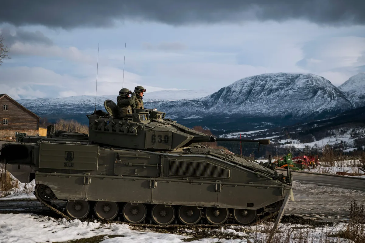 Spanish soldiers in an Pizarro tank during an exercise to defend an airfield as part of the Trident Juncture 2018, a NATO-led military exercise, on November 1, 2018 near the town of Oppdal, Norway.