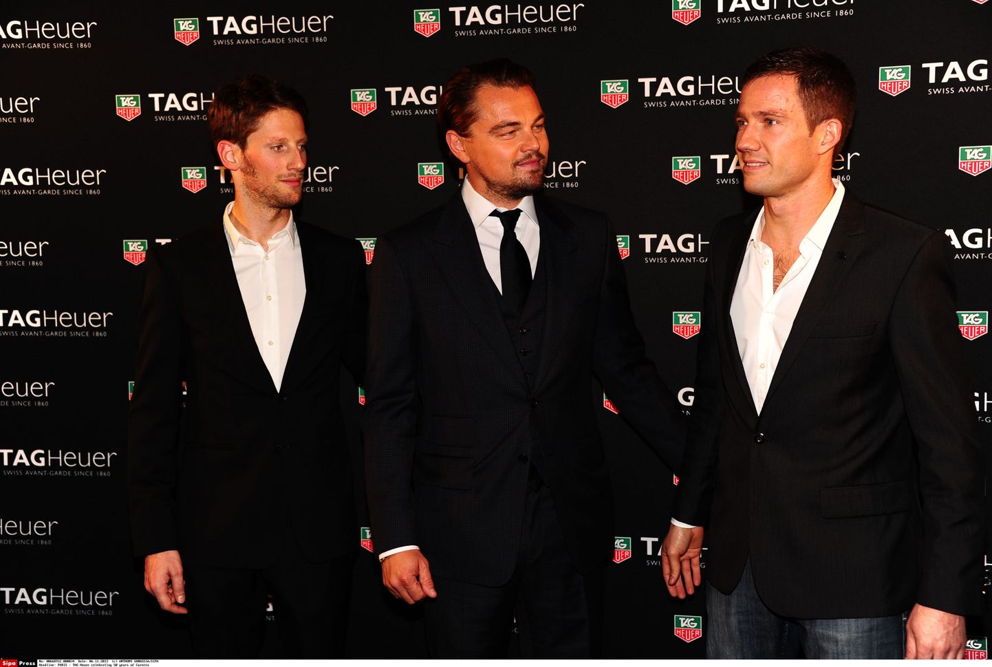 Leonardo DiCaprio (keskel) koos vormelipiloodi Romain Grosjeani (vasakul) ning rallipiloodi Sebastien Ogieriga.