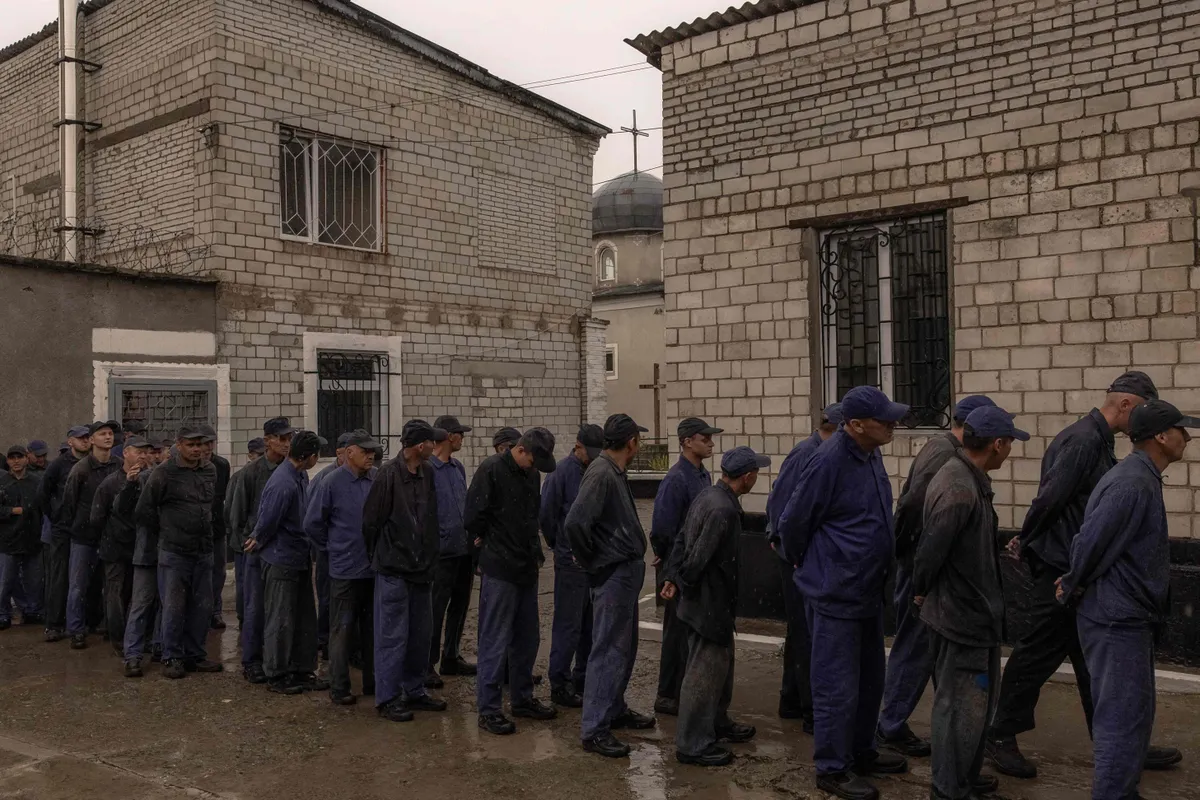 Russian prisoners of war stand in line for lunch at a prisoner of war camp in Western Ukraine on September 19, 2023.