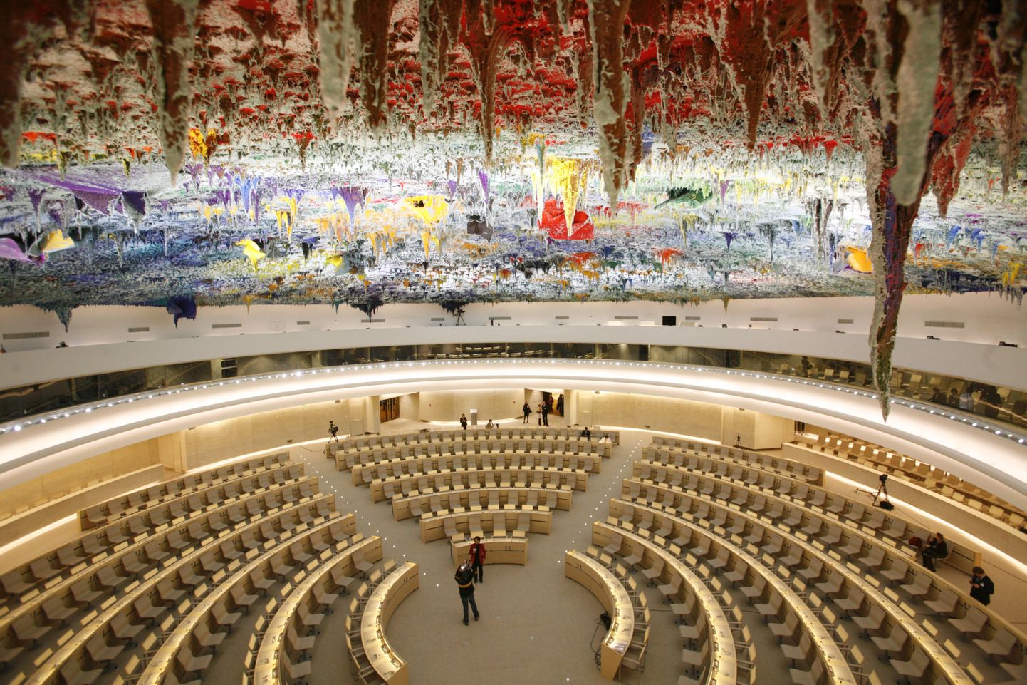 The newly renovated Room XX is pictured after the unveiling ceremony at the European headquarters of the United Nations in Geneva November 18, 2008. Spanish artist Miguel Barcelo was commissioned by the Foundation ONUART on the sixtieth anniversary of the Universal Declaration of Human Rights to undertake the painting of the ceiling, the most extensive work of art in the history of the United Nations at the venue for the Human Rights Council. Barcelo used over one hundred tones of paint with pigments from all corners of the globe on the enormous 1500 metres squared dome. The complete renovations to Room XX cost approximately 20 million Euros ($25 million) REUTERS/Denis Balibouse   (SWITZERLAND)
