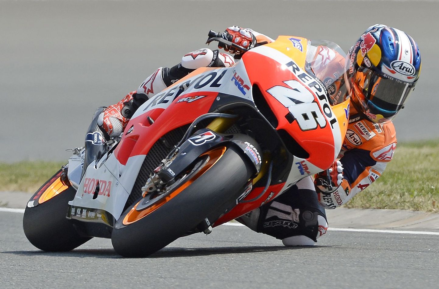 World Cup leader and Honda rider Dani Pedrosa of Spain speeds up during the MotoGP free practice at the Sachsenring circuit in Hohenstein-Ernstthal, near the city of Chemnitz, Germany, Friday, July 12, 2013. The Motorcycle Grand Prix of Germany is scheduled for Sunday, July 14 2013. (AP Photo/Jens Meyer) / SCANPIX Code: 436